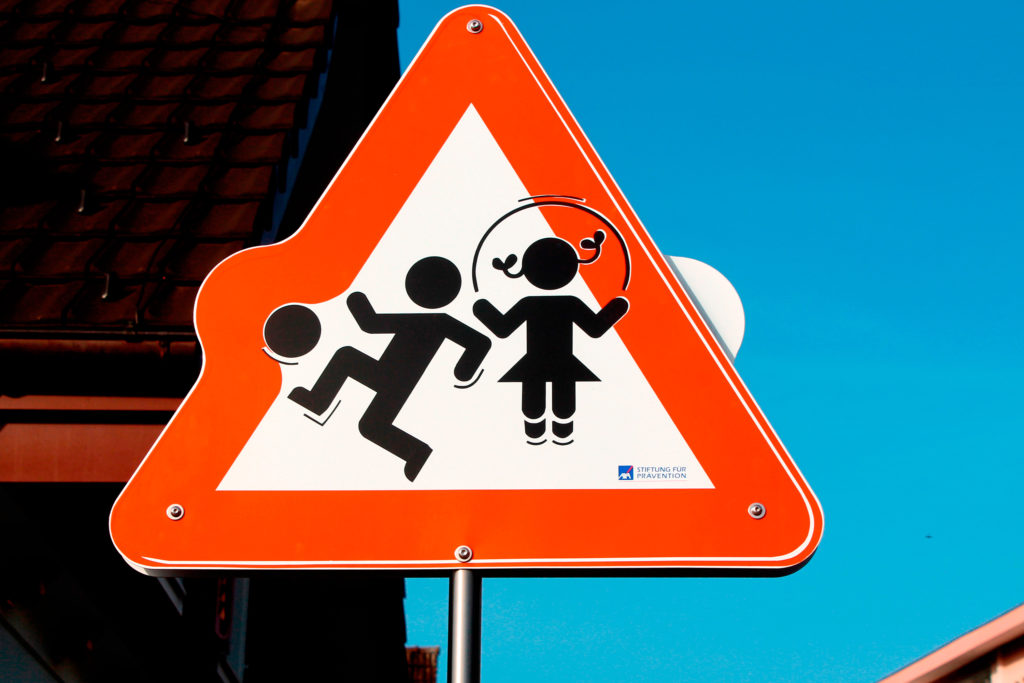 Canva Red and White Children Playing Road Signage 1 1024x683 - Kilka słów o bezpieczeństwie